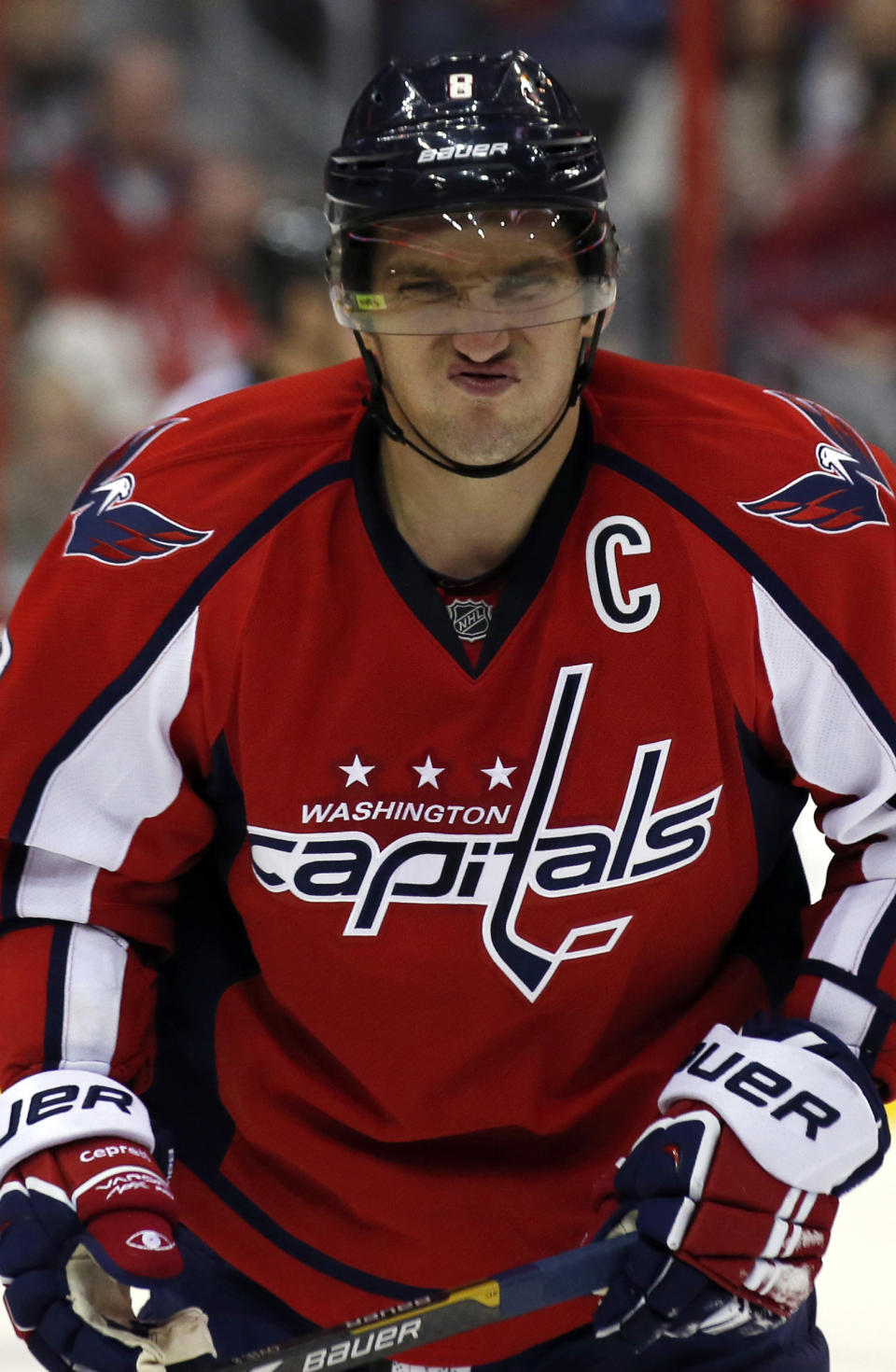 Washington Capitals right wing Alex Ovechkin reacts as he comes to the bench after a collision with Winnipeg Jets left wing Andrew Ladd during the third period of an NHL hockey game, Thursday, Feb. 6, 2014, in Washington. Ovechkin returned to the game, which the Capitals won 4-2. (AP Photo/Alex Brandon)