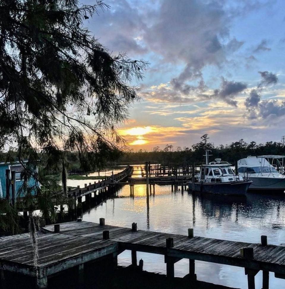 An Instagram post from VisitJacksonvilleNC sharing the "many faces of #TheNewRiver via @captbobbecksmarinacafe."