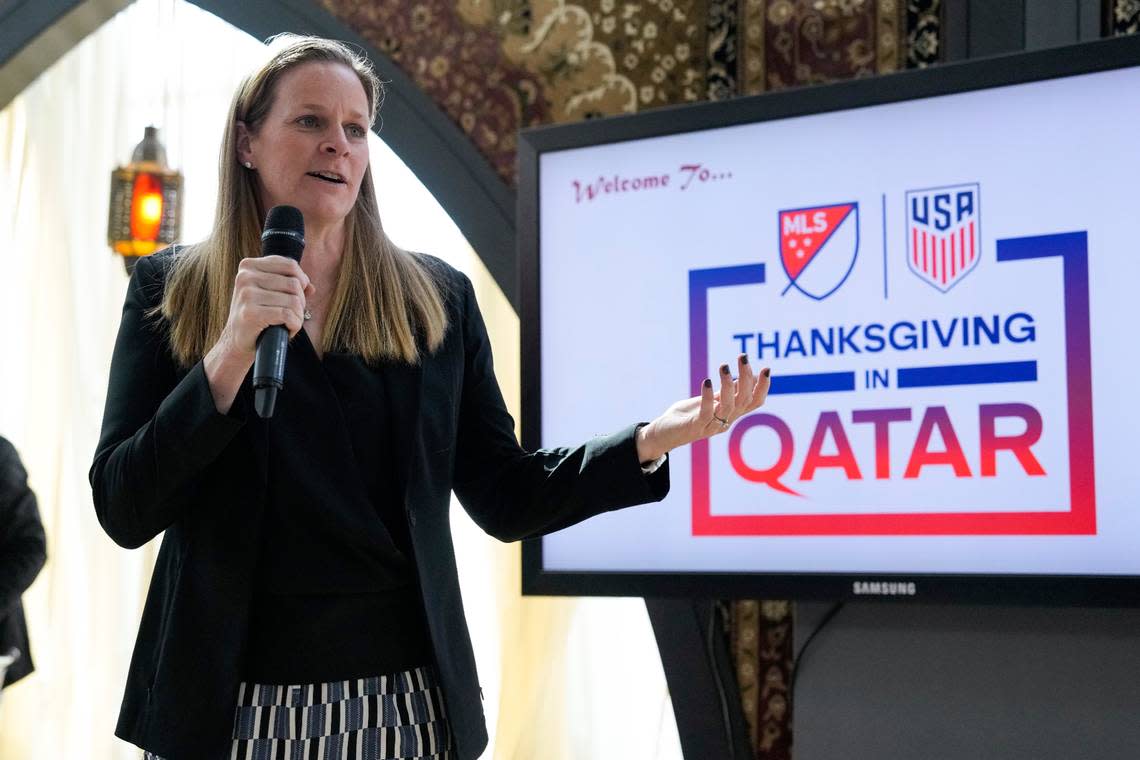 Cindy Parlow Cone, U.S. Soccer Federation president and former national team player, greets U.S. Soccer officials and members of the media at a Thanksgiving feast in Doha.