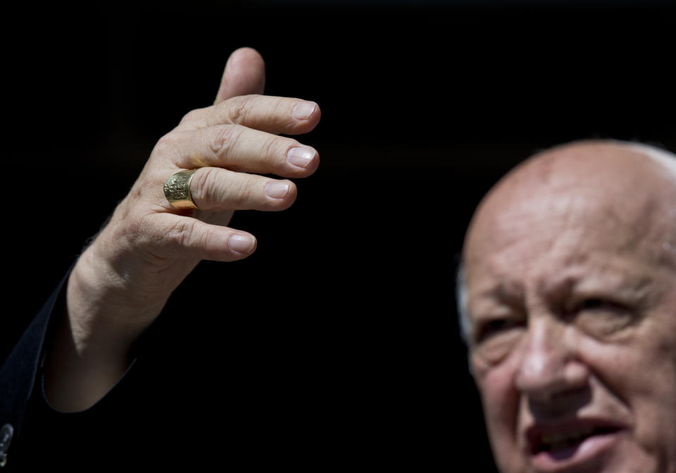 Cardinal Ricardo Ezzati, the archbishop of Santiago, gestures with his hand as he speaks during a news conference, in Santiago, Chile, Saturday, March 23, 2019. Pope Francis on Saturday replaced Ezzati as archbishop of Santiago, after he was placed under criminal investigation in the country's spiraling church sex abuse and cover-up scandal. (AP Photo/Esteban Felix)