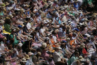The crowd watch the action on the Centre Court as Tunisia's Ons Jabeur plays Kazakhstan's Elena Rybakina in the final of the women's singles on day thirteen of the Wimbledon tennis championships in London, Saturday, July 9, 2022. (AP Photo/Alastair Grant)