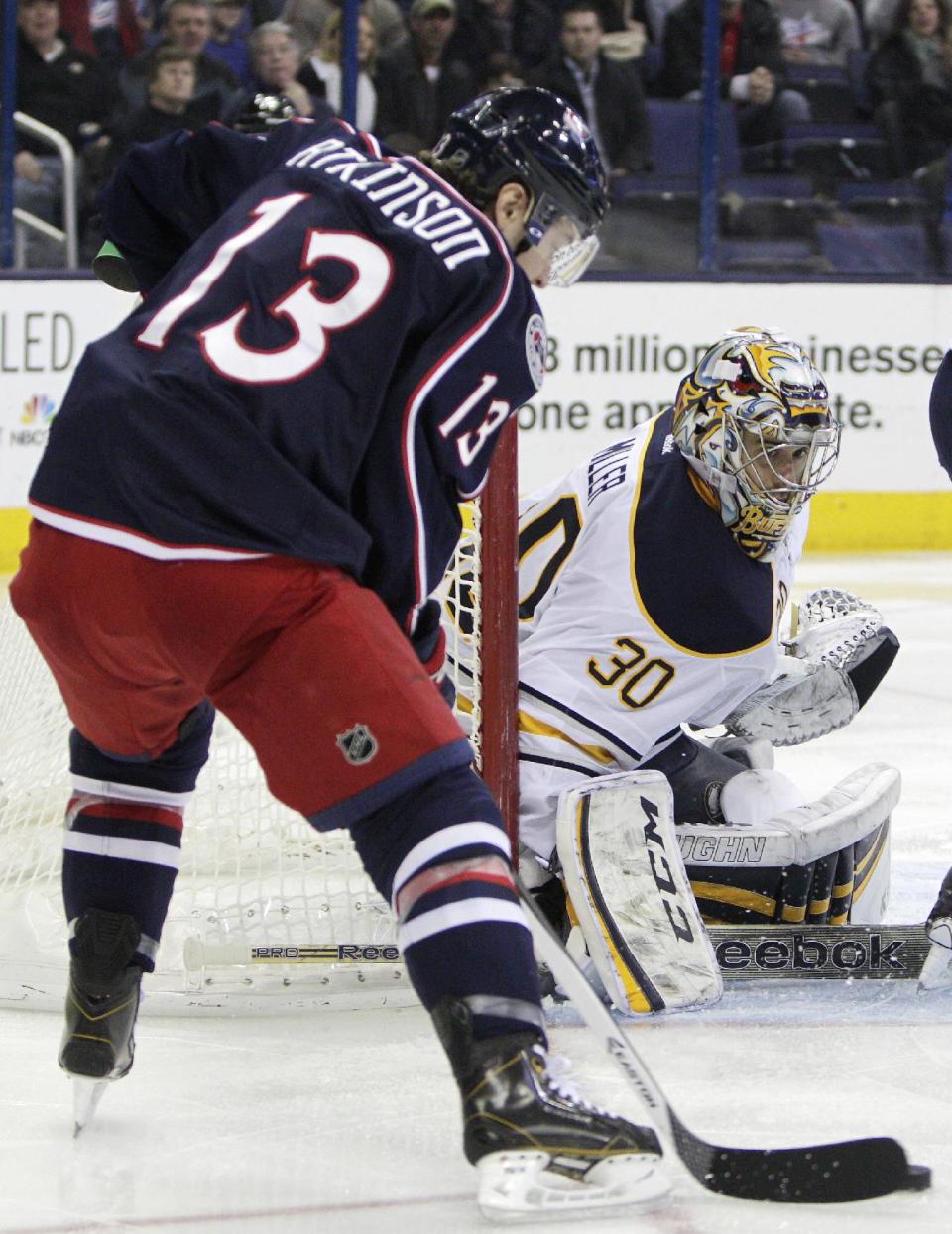 Buffalo Sabres' Ryan Miller, right, makes a save against Columbus Blue Jackets' Cam Atkinson during the second period of an NHL hockey game, Saturday, Jan. 25, 2014, in Columbus, Ohio. The Sabres won 5-2. (AP Photo/Jay LaPrete)