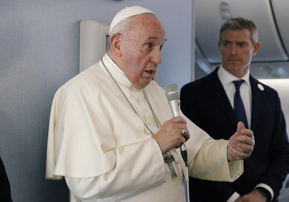 Pope Francis speaks during a news conference onboard the papal plane on his flight back from a trip to Thailand and Japan, Monday, Nov. 26, 2019. (Remo Casilli/Pool Photo via AP)