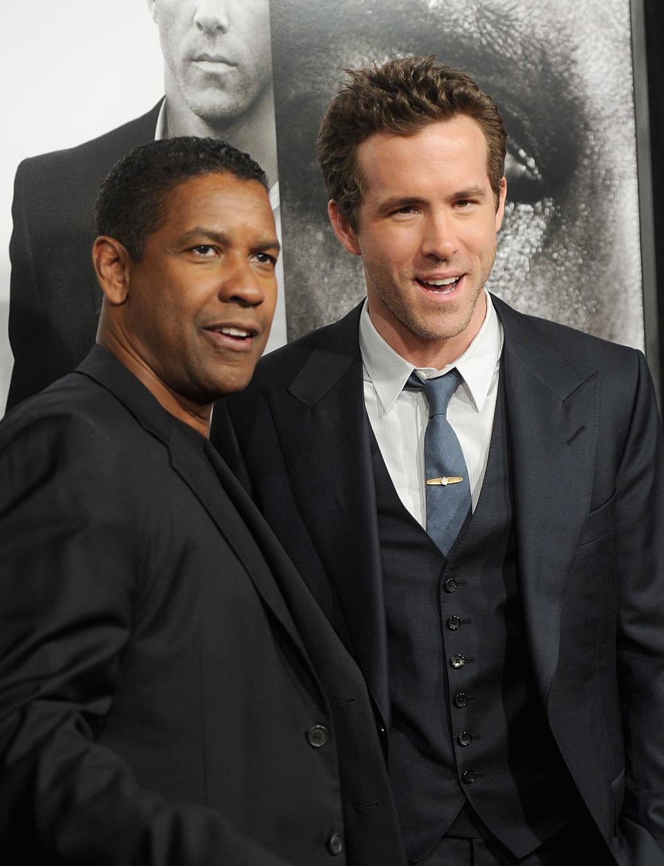 Denzel Washington and Ryan Reynolds attend the "Safe House" premiere at the SVA Theater on February 7, 2012 in New York City.