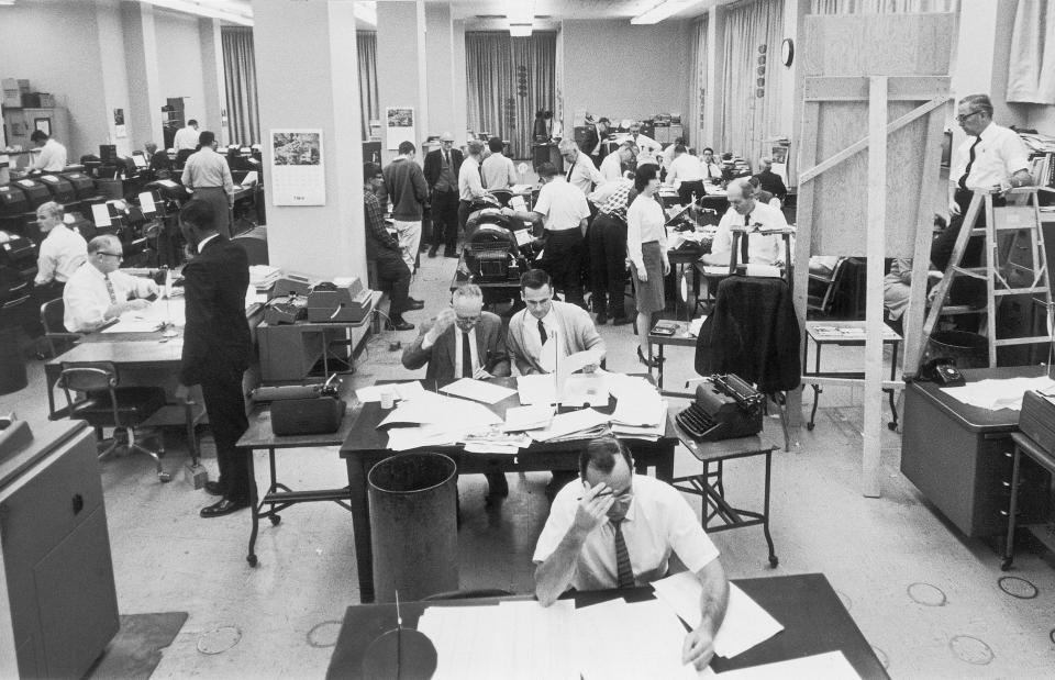 Staffers work on election night at the Washington, D.C. bureau of The Associated Press on Nov. 3, 1964. (AP Photo/File)