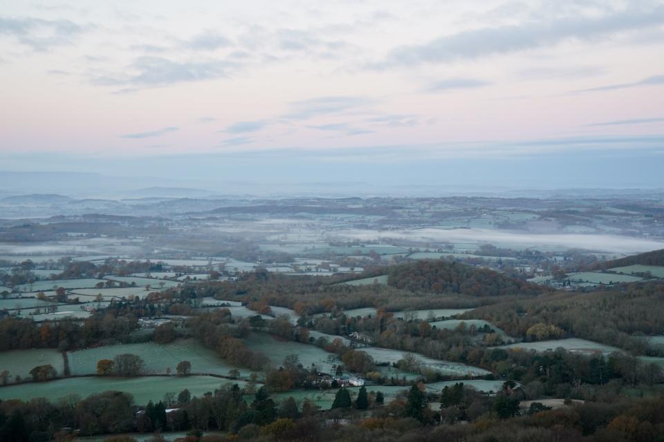 The sun rises over a foggy Worcestershire as seen from the Malvern Hills (Jacob King/PA Wire)