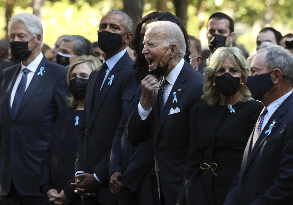 President Joe Biden, center, calls out as he is joined by, from left, former President Bill Clinton, former First Lady Hillary Clinton, former President Barack Obama, former First Lady Michelle Obama, First Lady Jill Biden and former New York City Mayor Michael Bloomberg, during the annual 9/11 Commemoration Ceremony at the National 9/11 Memorial and Museum on Saturday, Sept. 11, 2021 in New York. (Chip Somodevilla/Pool Photo via AP)