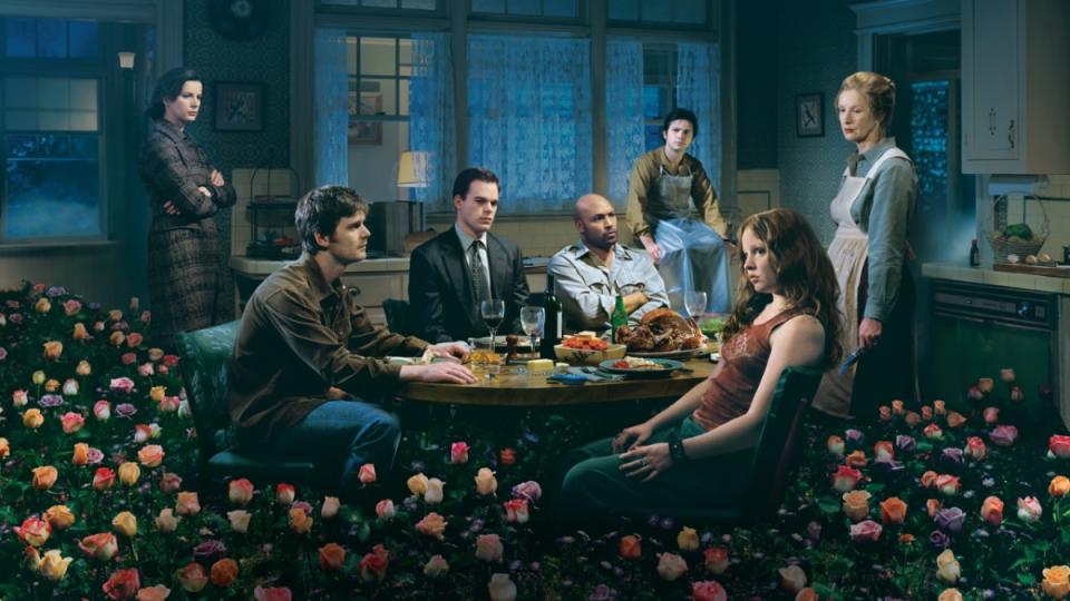 A promotional image featuring the cast of Six Feet Under.