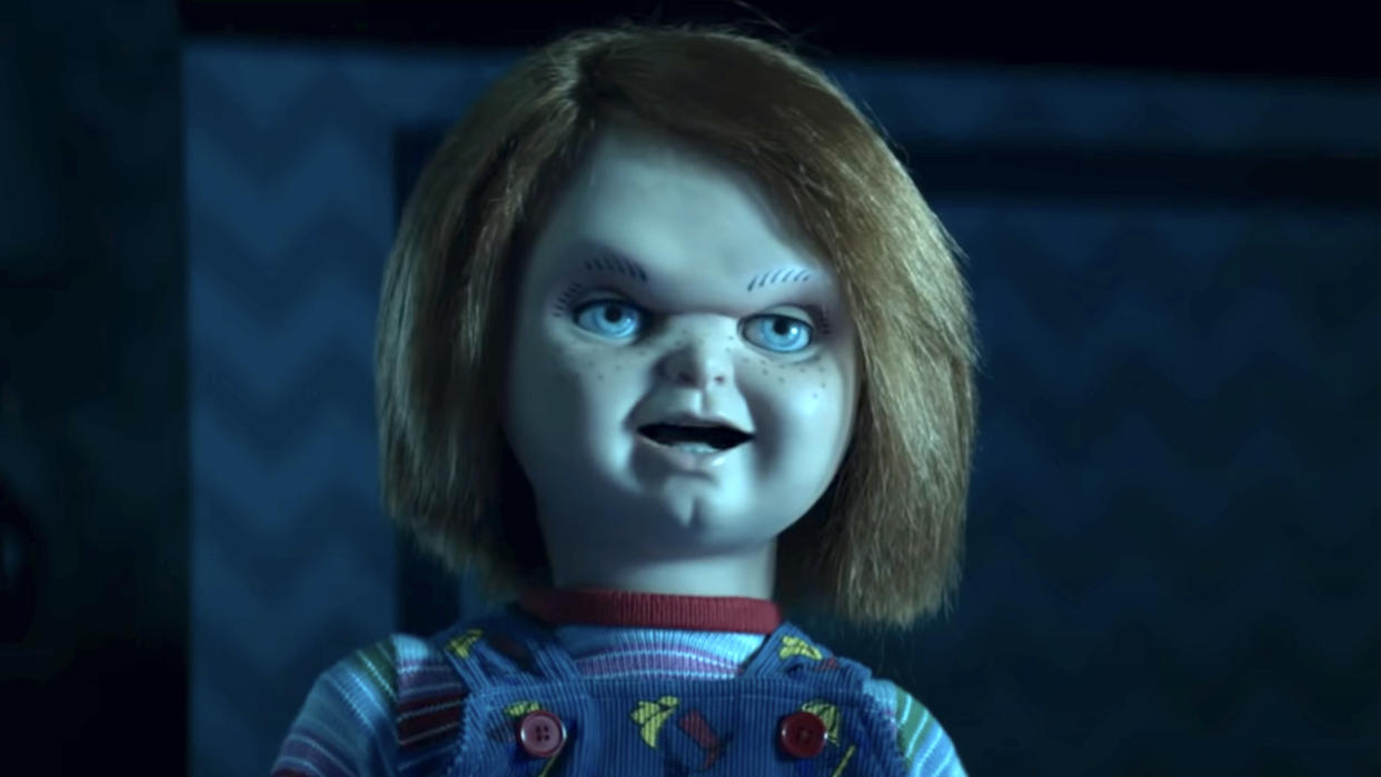  Chucky sneering while standing in the dark in Chucky Season 1. 