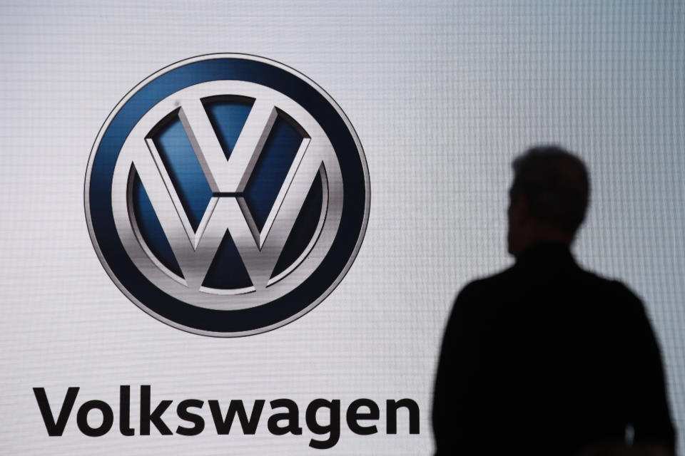 FILE - An attendee waits for the start of a news conference at the Volkswagen booth at the Los Angeles Auto Show in Los Angeles, Wednesday, Nov. 28, 2018. German auto supplier Bosch will pay $25 million to settle allegations by the California Air Resources Board under a settlement agreement from an emissions scandal that tarred Volkswagen and Fiat Chrysler, on Monday Nov. 7, 2022. (AP Photo/Jae C. Hong, File)