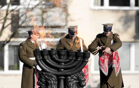 Soldiers prepare for the opening of newly built Museum of the History of Polish Jews in front of the Monument of the Heroes of the Ghetto in Warsaw October 28, 2014. REUTERS/Slawomir Kaminski/Agencja Gazeta