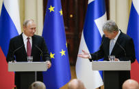 President of the Republic of Finland Sauli Niinisto, right, and Russian President Vladimir Putin speak during a news conference after their meeting at the President's official residence Mantyniemi in Helsinki, Finland, Wednesday, Aug. 21, 2019. (AP Photo/Alexander Zemlianichenko, Pool)