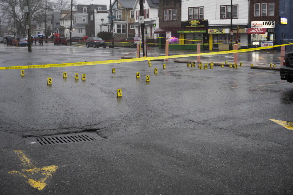 Evidence markers are seen following a shooting in Northeast Philadelphia on Wednesday, March 6, 2024. Four shootings over four days in Philadelphia left three dead and 12 injured, many of them children — violence that put renewed focus on safety within the sprawling mass transit system and gave ammunition to critics of the city's progressive chief prosecutor. (AP Photo/Joe Lamberti)