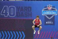 TCU quarterback Max Duggan warms up before he runs the 40-yard dash at the NFL football scouting combine in Indianapolis, Saturday, March 4, 2023. (AP Photo/Michael Conroy)