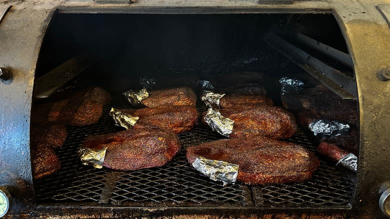 Briskets cooking in a smoker