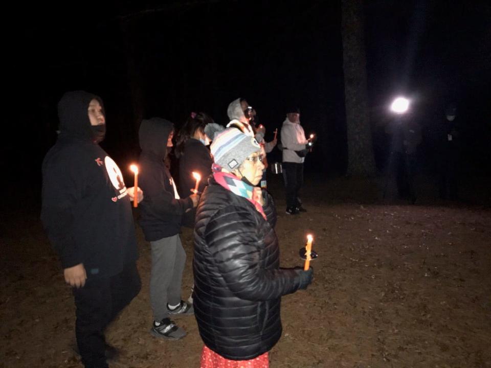 FILE - View from a candlelight vigil for victims and survivors of alleged abuse at Catholic schools on the Menominee Reservation Nov. 2, 2021, on All Soul's Day in Keshena.