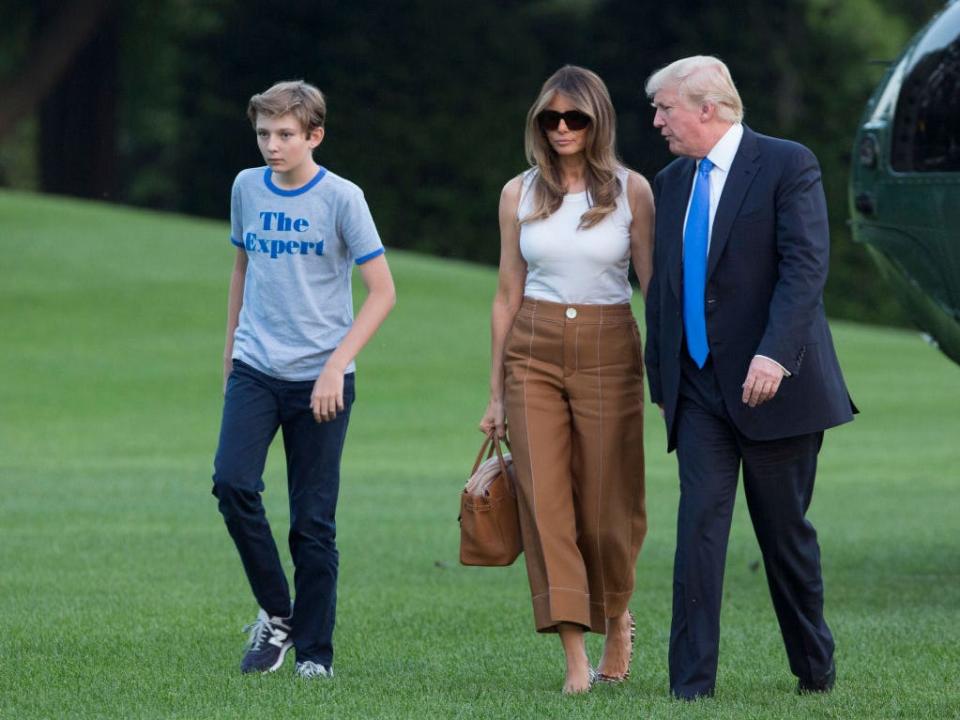 Donald Trump, Melana Trump, and Barron Trump arrive at the White House in 2017