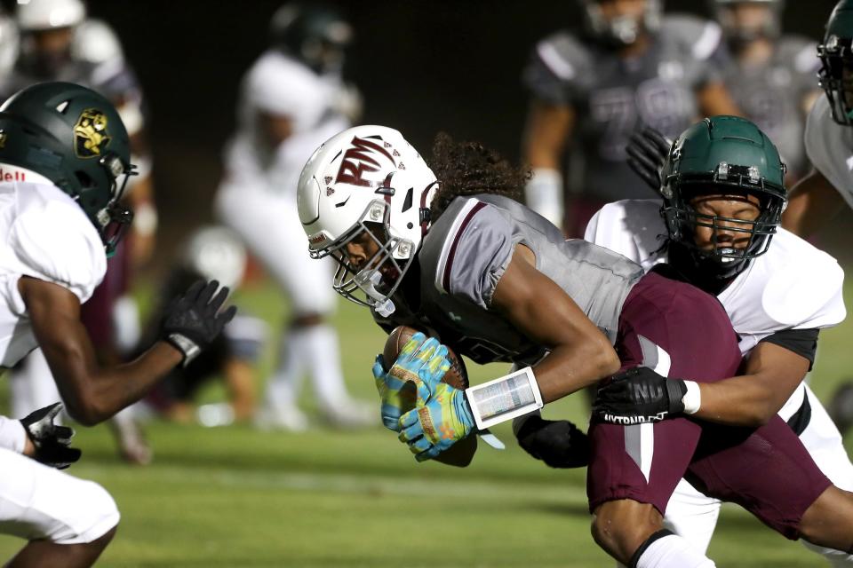 Jeremiah Johnson (2) of Ranch Mirage High maintains control of the ball after a catch against Tahquitz in Rancho Mirage, Calif., on August 31, 2023.