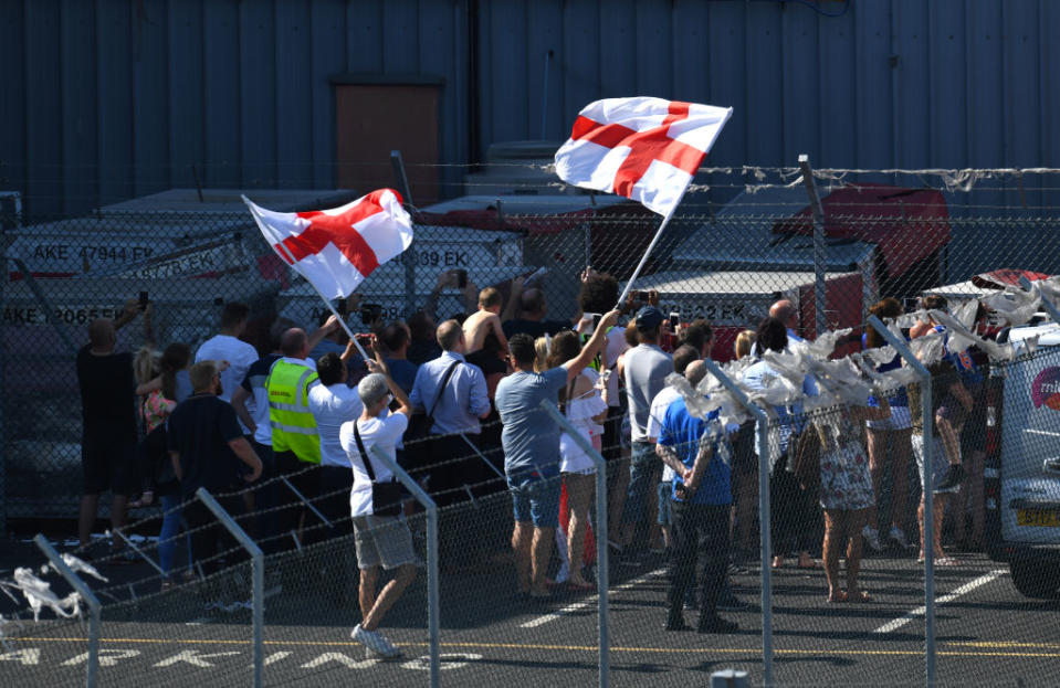 <p>Fans await the arrival of the England team at Birmingham Airport as the England squad return to the UK. PRESS ASSOCIATION Photo. Picture date: Sunday July 15, 2018. See PA story WORLDCUP England. Photo credit should read: Joe Giddens/PA Wire </p>