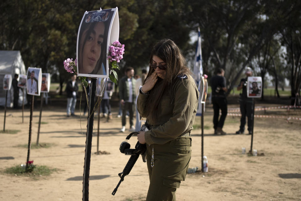 An Israeli soldier weeps at the marker for a loved one kidnapped on Oct. 7 in a cross-border attack by Hamas at the Nova music festival, after a press conference at the site in Re'im, southern Israel, Friday, Jan. 5, 2024. (AP Photo/Maya Alleruzzo)