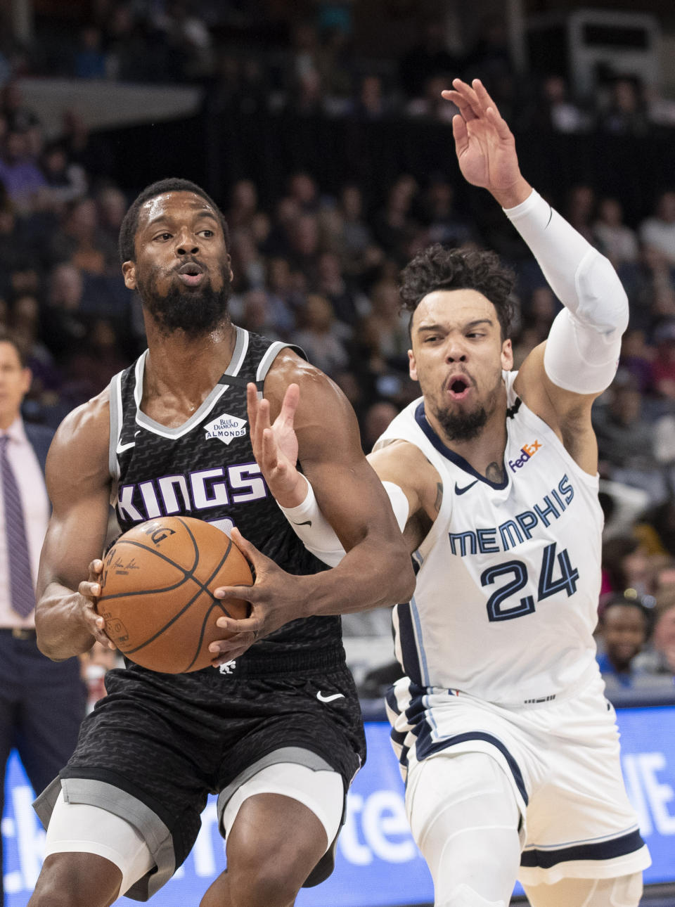 Sacramento Kings forward Harrison Barnes (40) drives to the basket while defended by Memphis Grizzlies guard Dillon Brooks (24) during the first half of an NBA basketball game Friday, Feb. 28, 2020, in Memphis, Tenn. (AP Photo/Nikki Boertman)