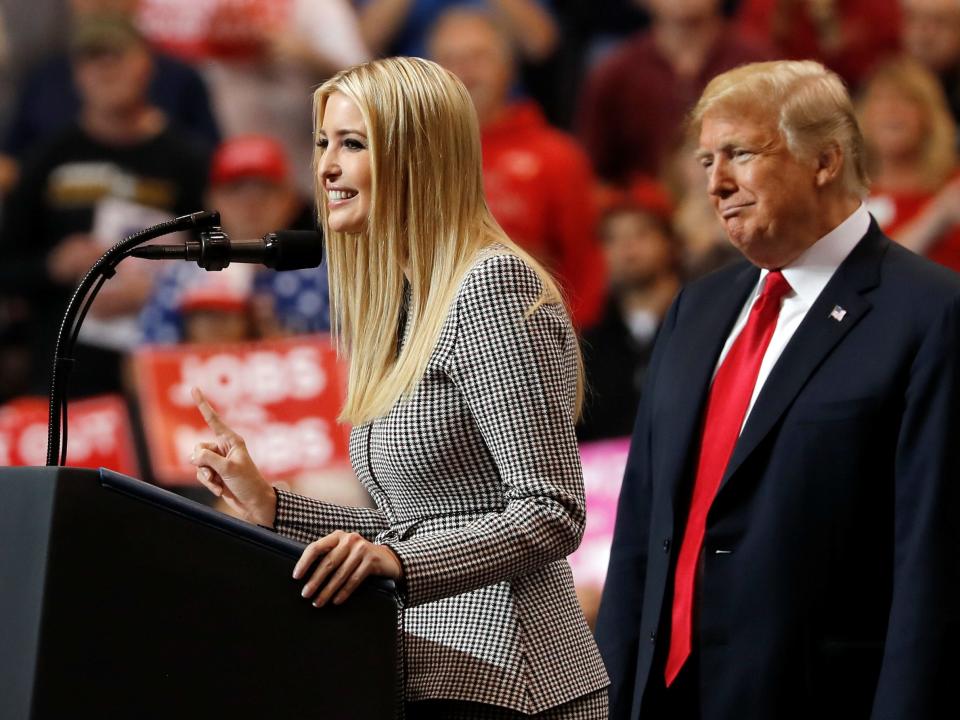 FILE PHOTO - U.S. President Donald Trump listens as his daughter, White House senior adviser Ivanka Trump, speaks during a campaign rally on the eve of the U.S. midterm election in Cleveland, Ohio, U.S., November 5, 2018. REUTERS/Carlos Barria