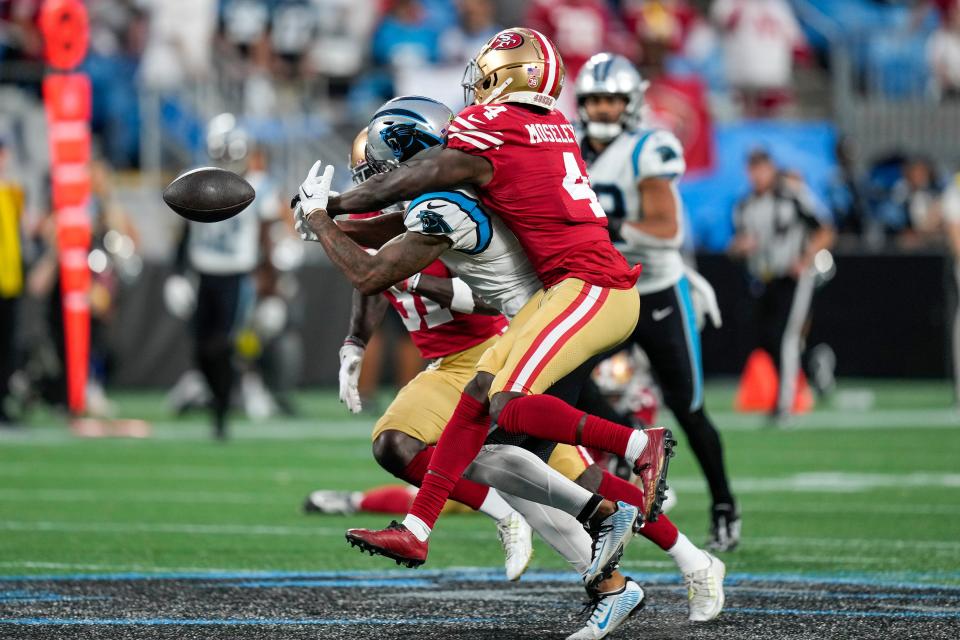 Carolina Panthers receiver Shi Smith cannot catch the pass defended by San Francisco 49ers cornerback Emmanuel Moseley during the second half Oct. 9, 2022 in Charlotte.