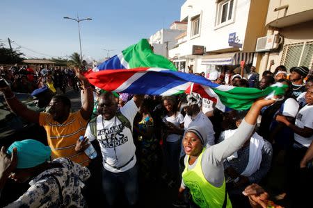 Supporters of president-elect Adama Barrow celebrate his inauguration at Gambia's embassy in Dakar, Senegal January 19, 2017. REUTERS/Thierry Gouegnon