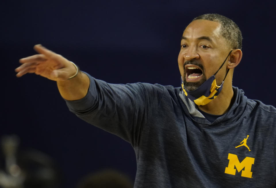 FILE - Michigan head coach Juwan Howard gestures during the first half of an NCAA college basketball game against Ball State in Ann Arbor, Mich., in this Wednesday, Dec. 2, 2020, file photo. Michigan coach Juwan Howard was honored as The Associated Press men's basketball coach of the year on Thursday, April 1, 2021. (AP Photo/Paul Sancya, File)