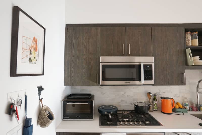 Kitchen with white countertop and stainless steel appliances.