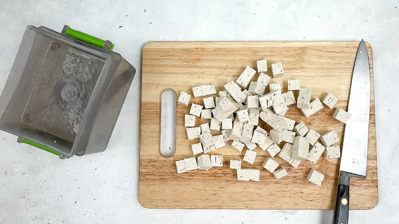 diced tofu on wooden board