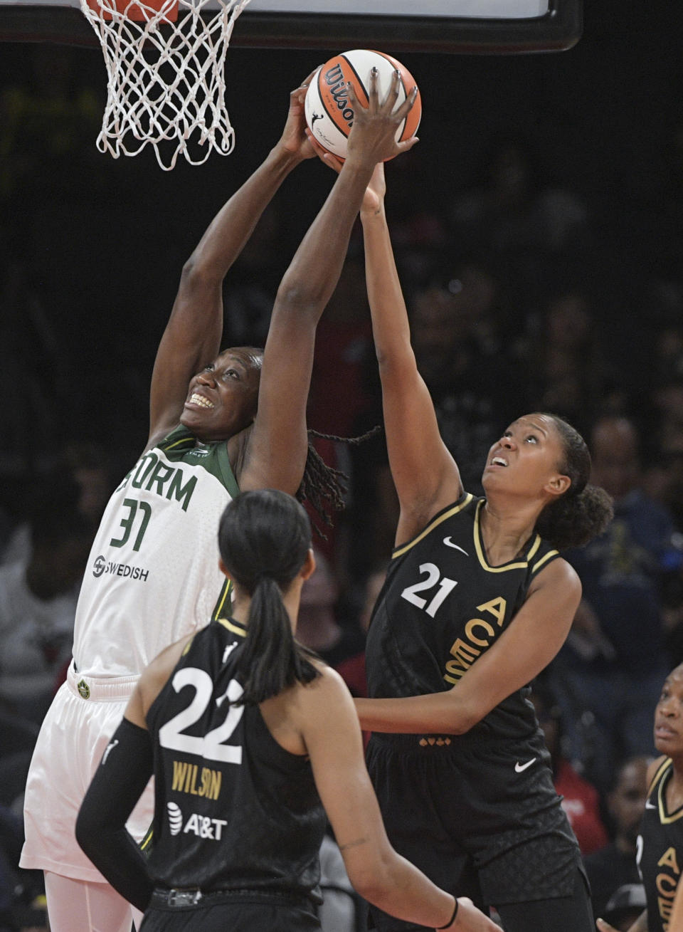 Seattle Storm center Tina Charles (31) and Las Vegas Aces center Iliana Rupert (21) fight for a rebound during the first half of a WNBA basketball game Sunday, Aug. 14, 2022, in Las Vegas. (AP Photo/Sam Morris)