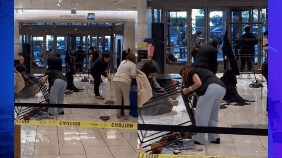 Store employees cleaning up after a mob of thieves swarmed a Nordstrom in Canoga Park during a destructive robbery on August 12, 2023. (Garret Jiroux)