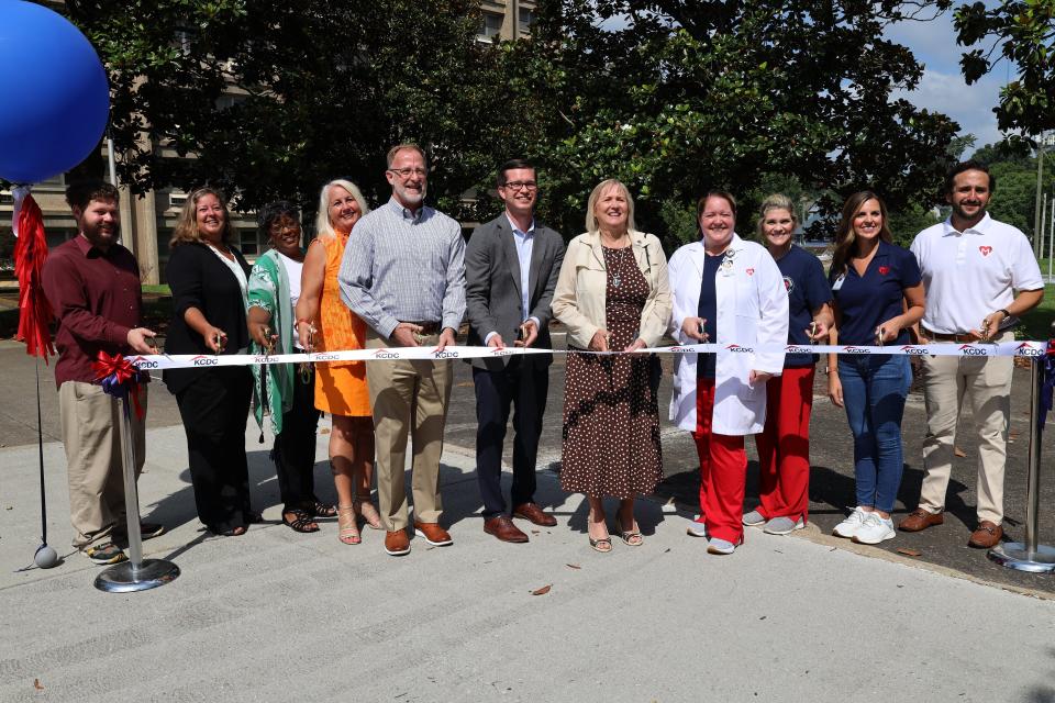 Representatives from Knoxville’s Community Development Corporation and Matter Health officially open a wellness center for residents of KCDC’s Love Towers on July 6. The center provides convenient resident access to primary care and lifestyle support. From left, Thomas Bleeker, Marisa Moazen, Beverly Mack, Darlene Farmer, board vice chair Scott Broyles and CEO and Executive Director Ben Bentley of KCDC; State Sen. Becky Duncan Massey; and Caryn Pickens, Wendy Hodge, Crystal Brunson and Mason Mercy of Matter Health.