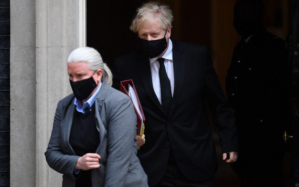 The Prime Minister heads into Parliament for PMQs - AFP