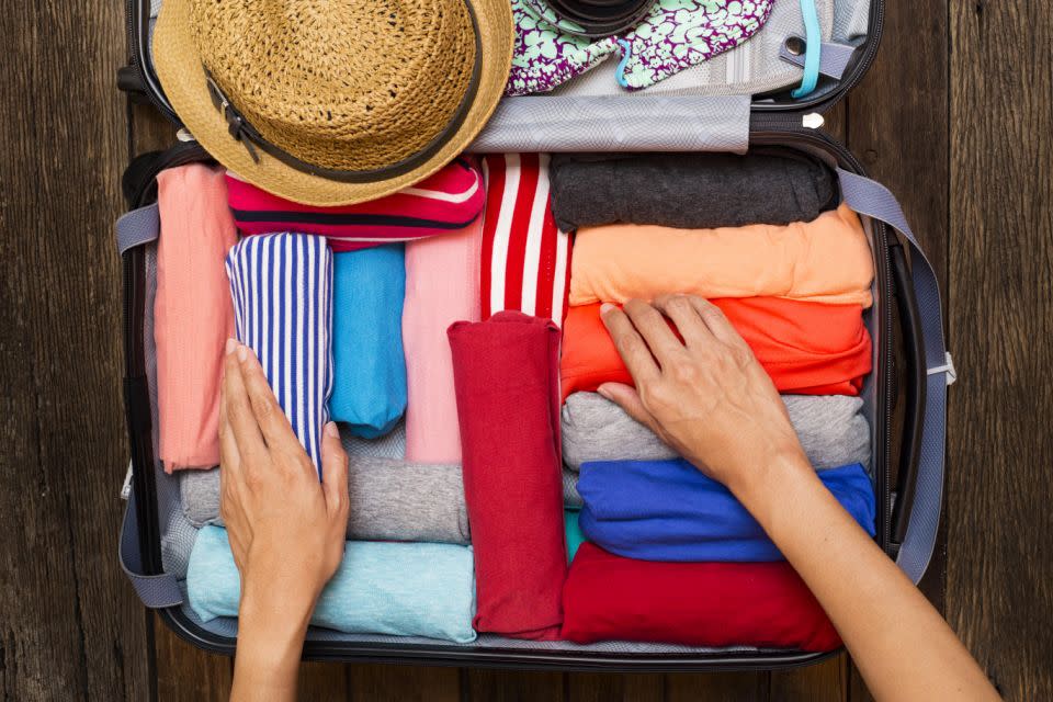 Chris rolls and folds his clothes to maximise space. Photo: Getty