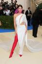 Lily Aldridge made her fahion mark in this Ralph Lauren white cut-out gown with a face scarf and thigh-high red boots.