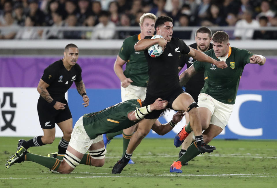 New Zealand's Anton Lienert-Brown makes a break during the Rugby World Cup Pool B game at International Stadium between New Zealand and South Africa in Yokohama, Japan, Saturday, Sept. 21, 2019. (AP Photo/Jae Hong)