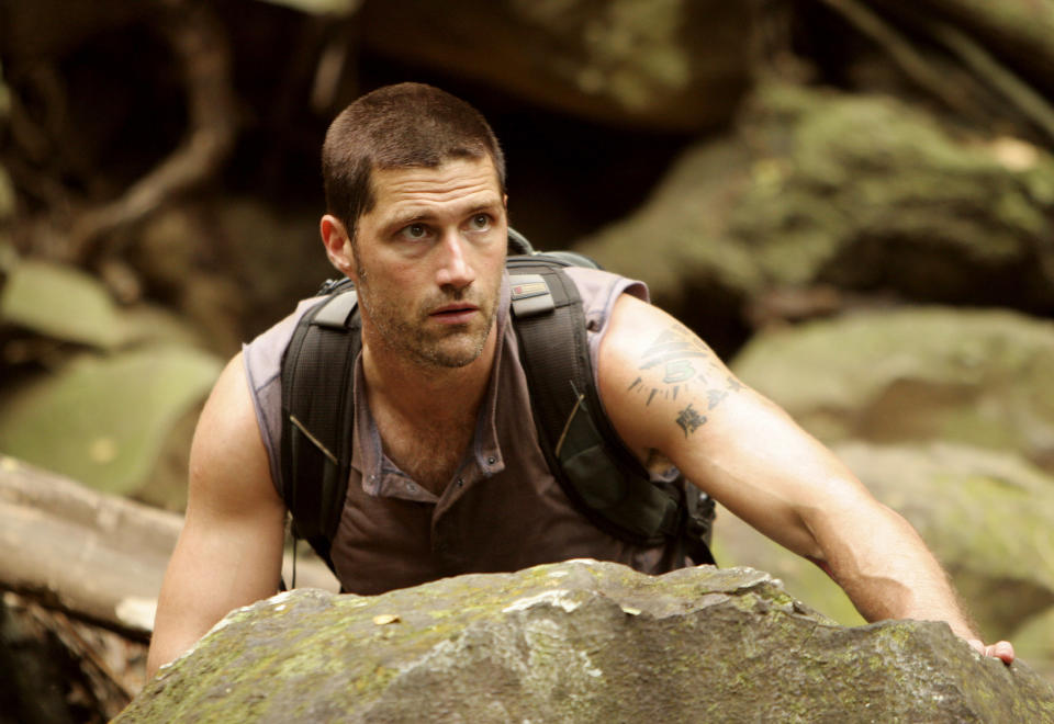 a character climbing a large rock