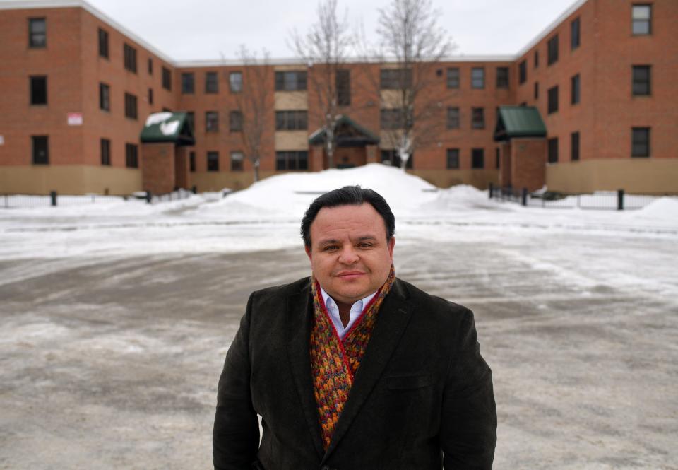 Alex Corrales, chief executive officer of the Worcester Housing Authority, outside the Curtis Apartments in a 2022 photo.