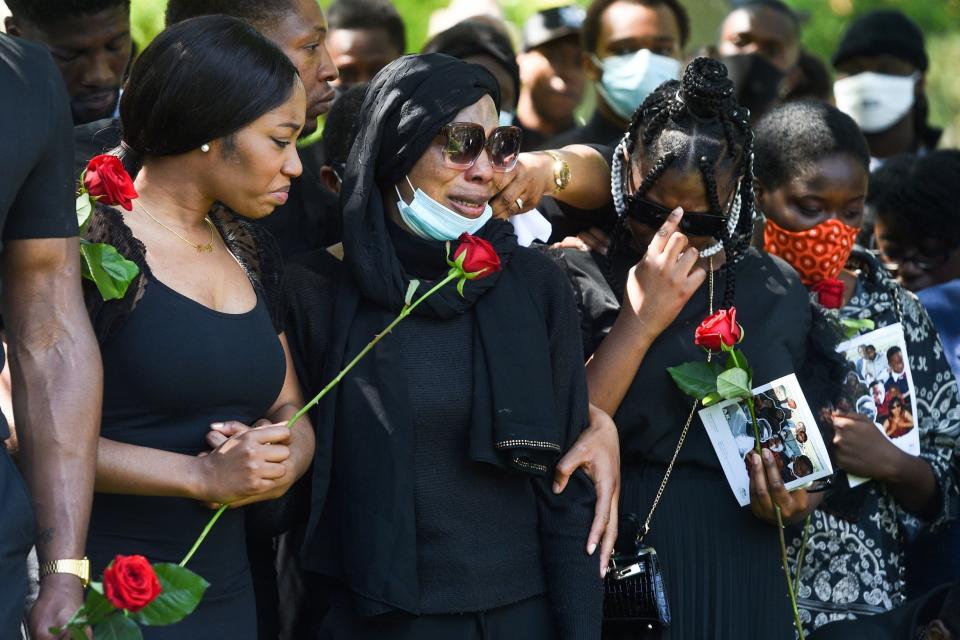 The family at Alexander Kareem's funeral (PA)