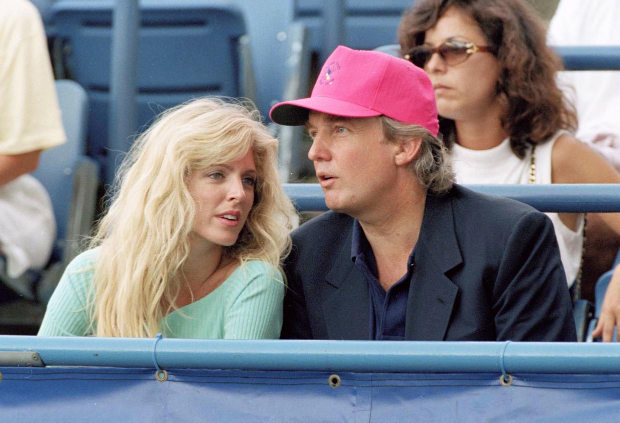 Donald Trump and Marla Maples watch the tennis action at the U.S. Open in New York, on Sept. 8, 1992.