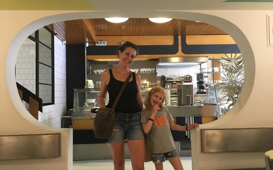 Ellen with one of her daughters in a café in Bologna