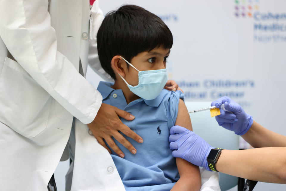 Jaishan Baweja, 8, reacts as he receives the Pfizer-BioNTech COVID-19 vaccine at Cohen Children's Medical Center as vaccines were approved for children aged 5-11, amid the coronavirus disease pandemic, in New Hyde Park, New York, U.S., November 4, 2021. REUTERS/Andrew Kelly