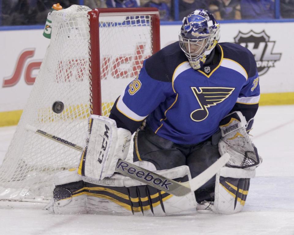 St. Louis Blues goalie Ryan Miller (39) makes a stick save during the first period of an NHL hockey game against the Washington Capitals, Tuesday, April 8, 2014, in St. Louis.(AP Photo/Tom Gannam)