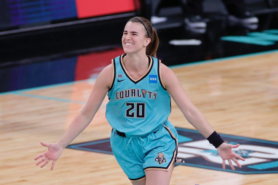 Sabrina Ionescu celebrates hitting a game-winning shot for the New York Liberty.