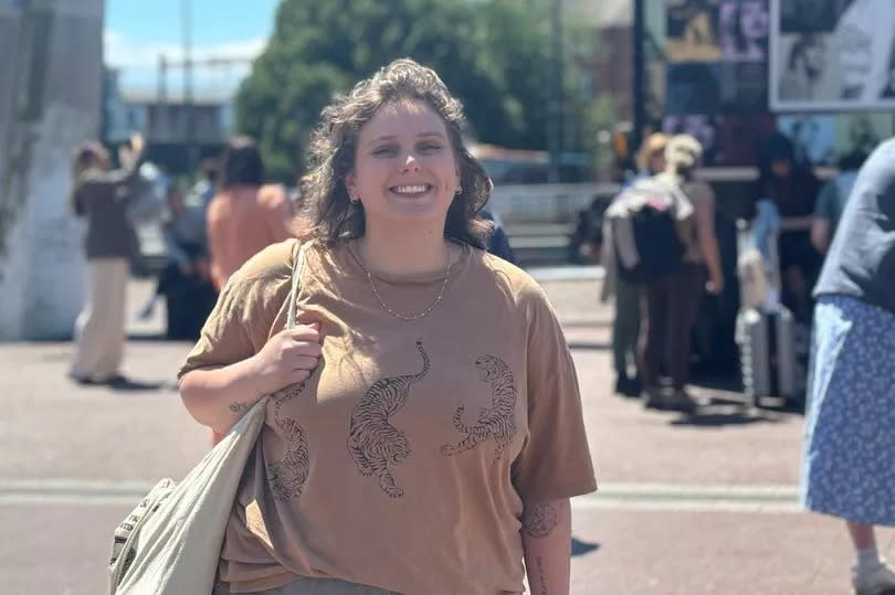 Woman smiling in sunshine the day before the Taylor Swift concert