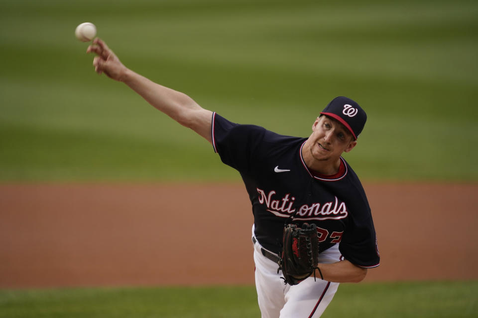 Washington Nationals' Erick Fedde delivers a pitch during the first inning of the team's baseball game against the New York Mets, Friday, June 18, 2021, in Washington. (AP Photo/Carolyn Kaster)