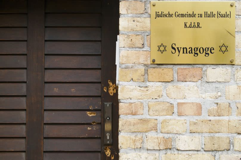 Bullet holes in the wooden door of the synagogue in Halle, Germany.