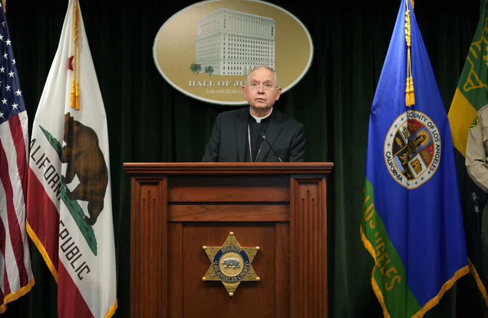 Archbishop of Los Angeles, Jose H. Gomez thanks Los Angeles County Sheriff Robert Luna's deputies and investigators during a news conference announcing an arrest has been made in connection to the murder of Catholic auxiliary Bishop David O'Connell, who was fatally shot over the weekend in Southern California, at the Hall of Justice Monday, Feb. 20, 2023, in Los Angeles. (AP Photo/Damian Dovarganes)